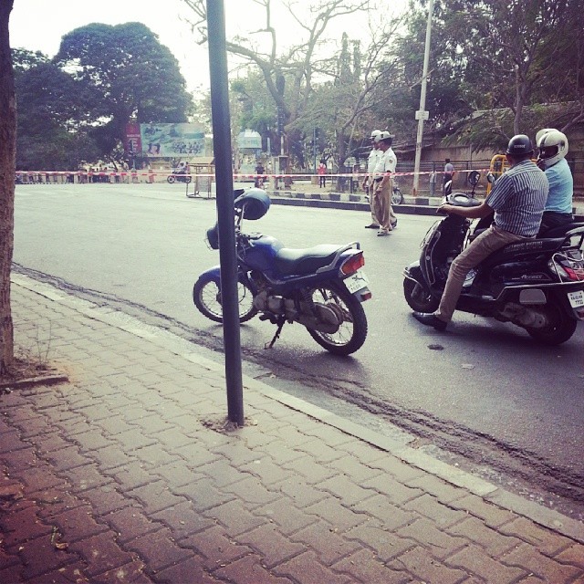Roads are closed for pedestrians because some VIP is passing. Strange but happens in India.